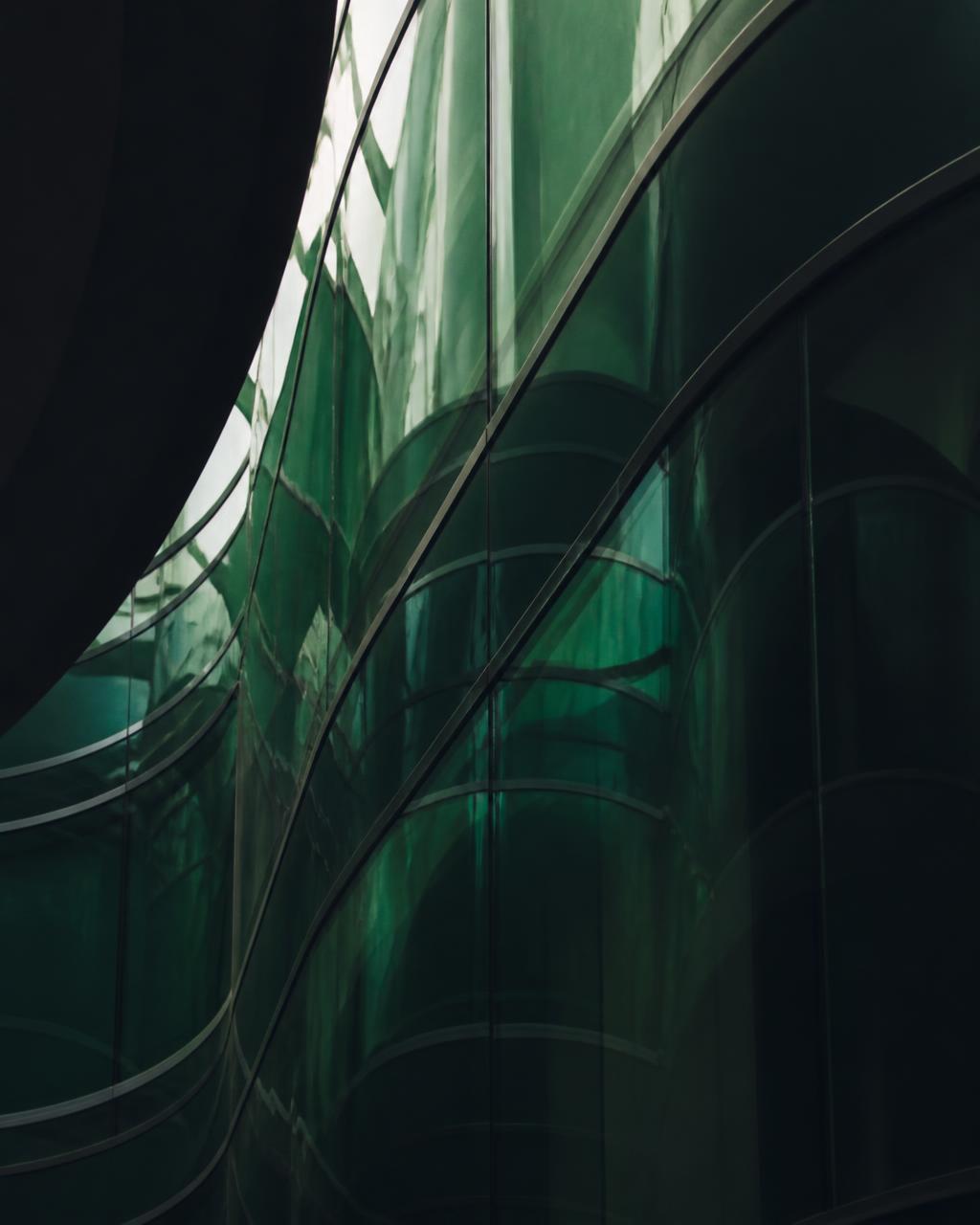 Abstract architectural glass with deep green tones
